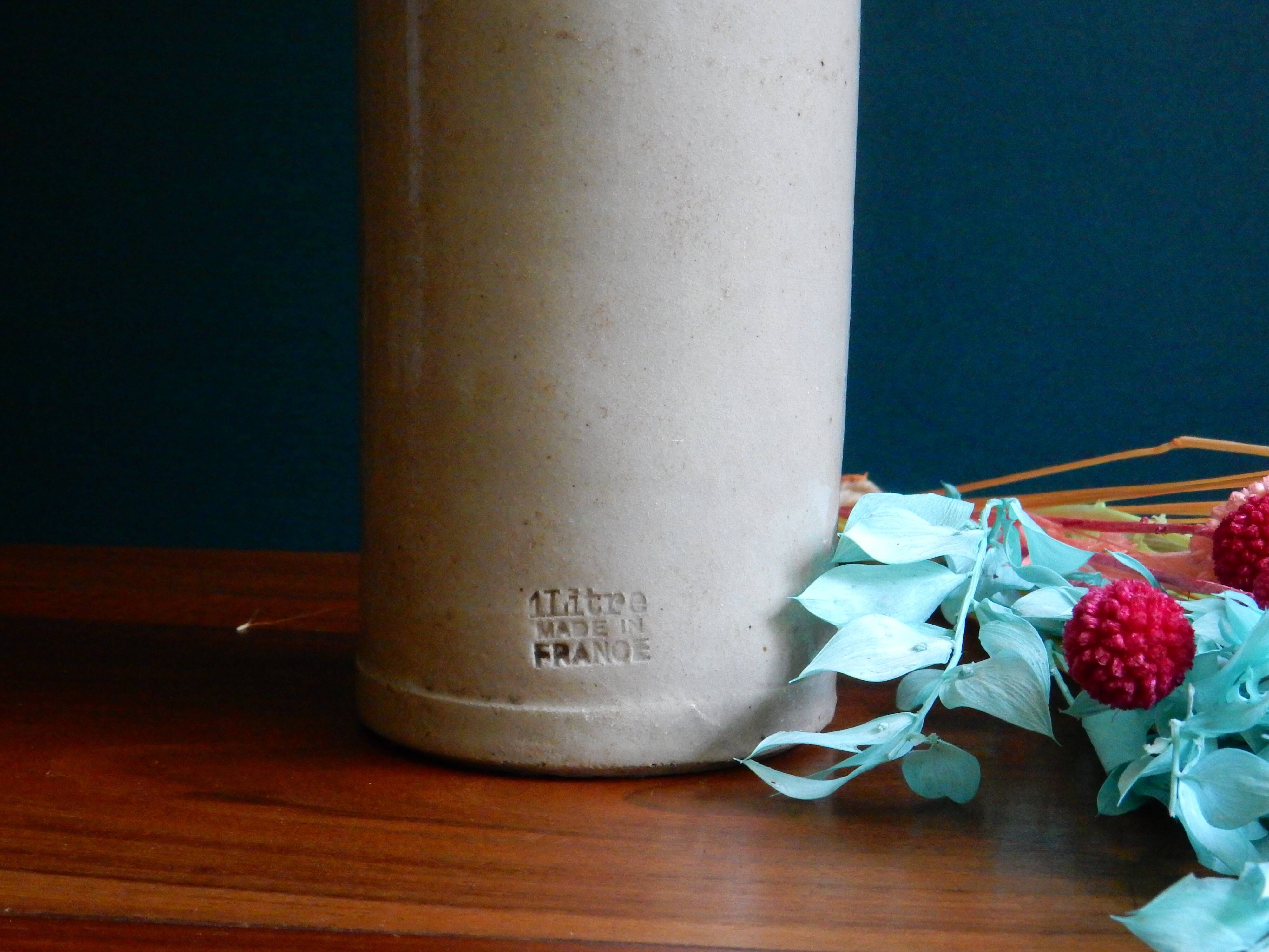 Enamelled white stoneware bottle
