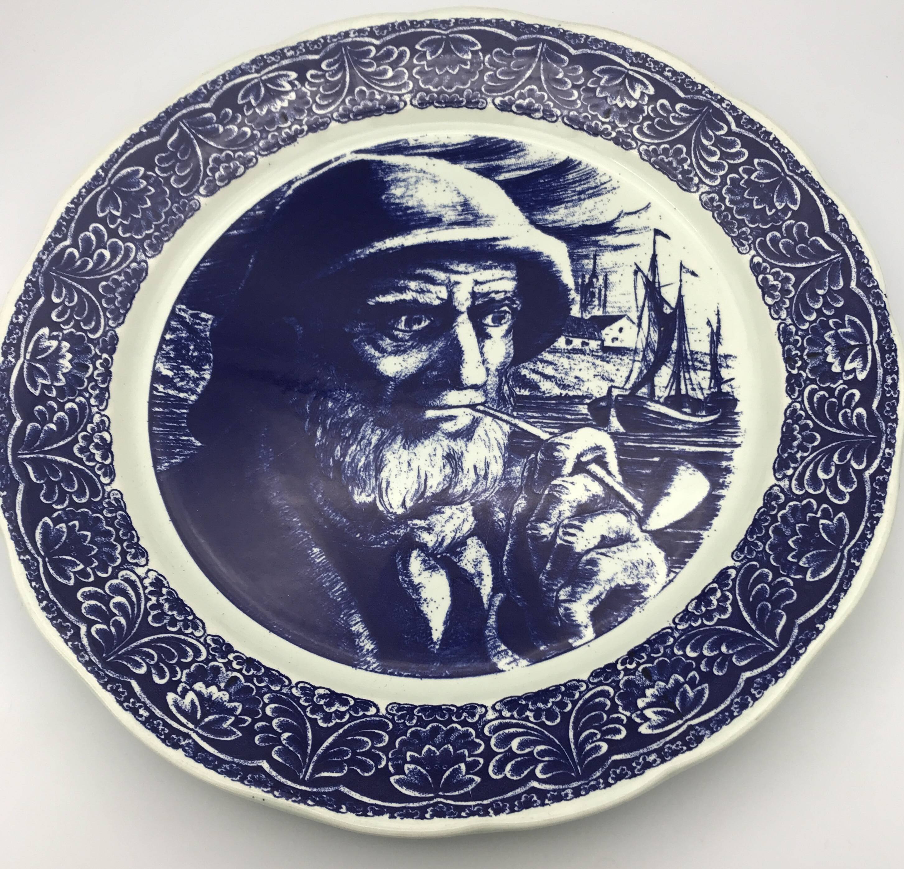 Blue enamelled earthenware wall plate with fisherman decor, Boch La Louvière, Belgium
