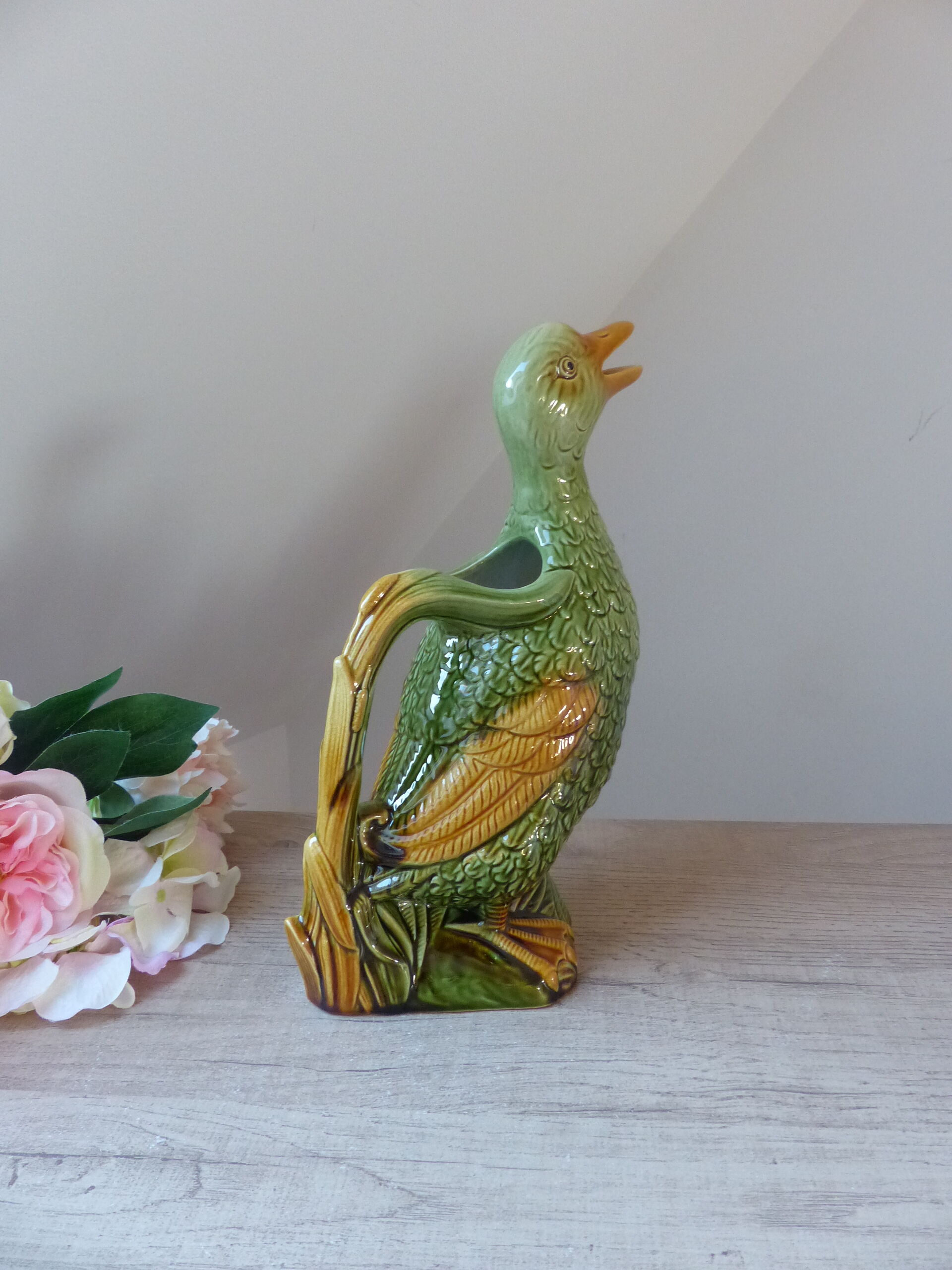 Pitcher zoomorph duck in green and yellow slip