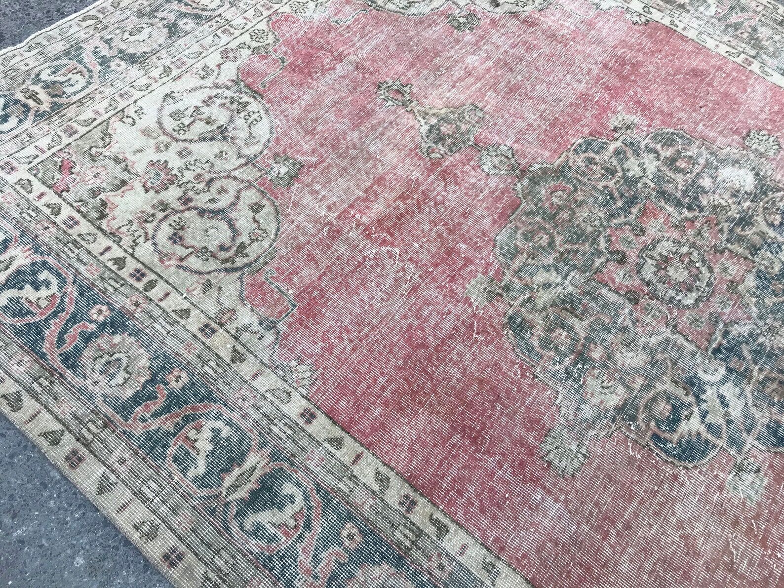 Pale pink rug with medallion