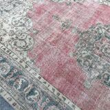 Pale pink rug with medallion