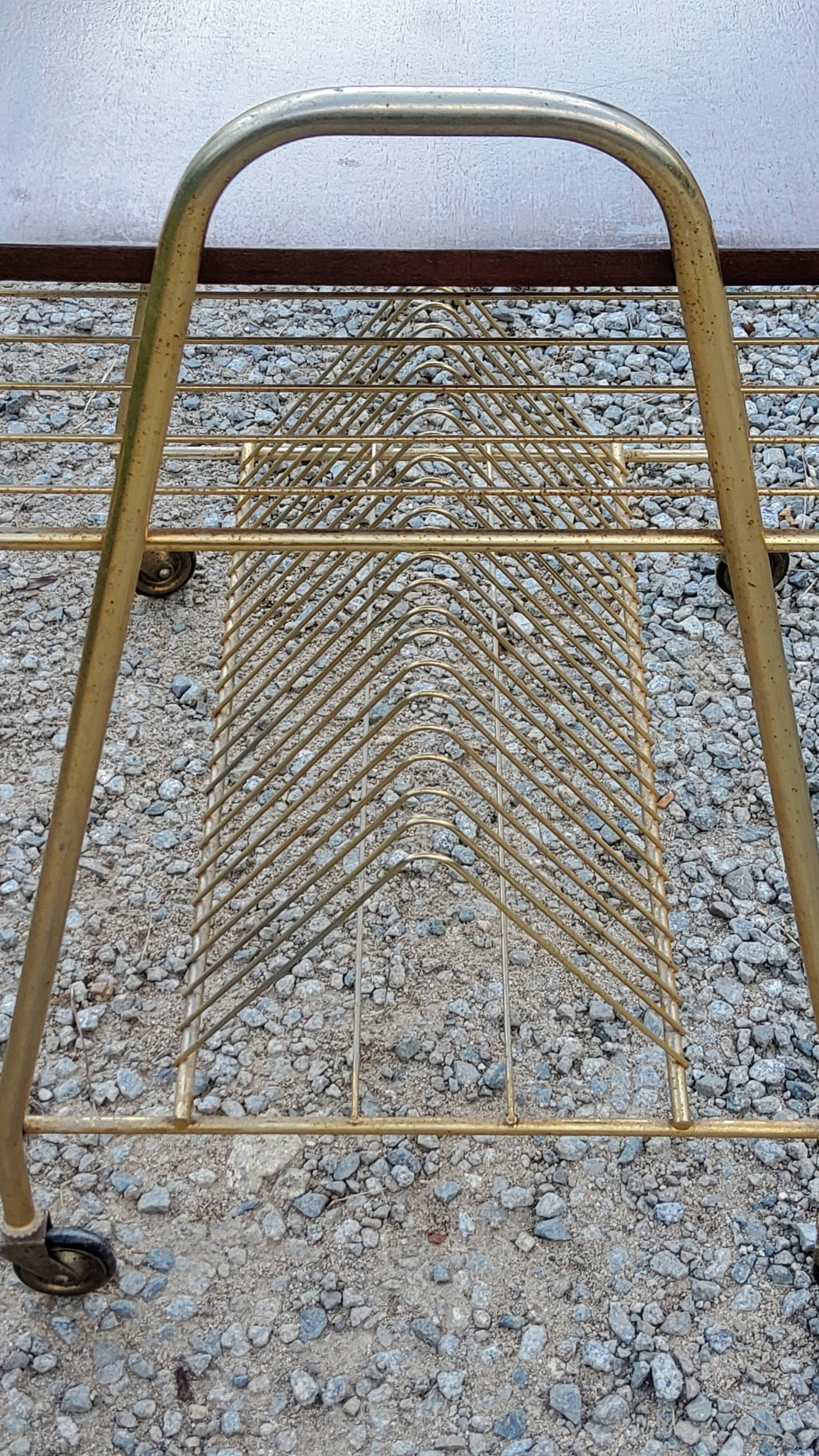 Side table of the 60s mahogany and gold metal range discs