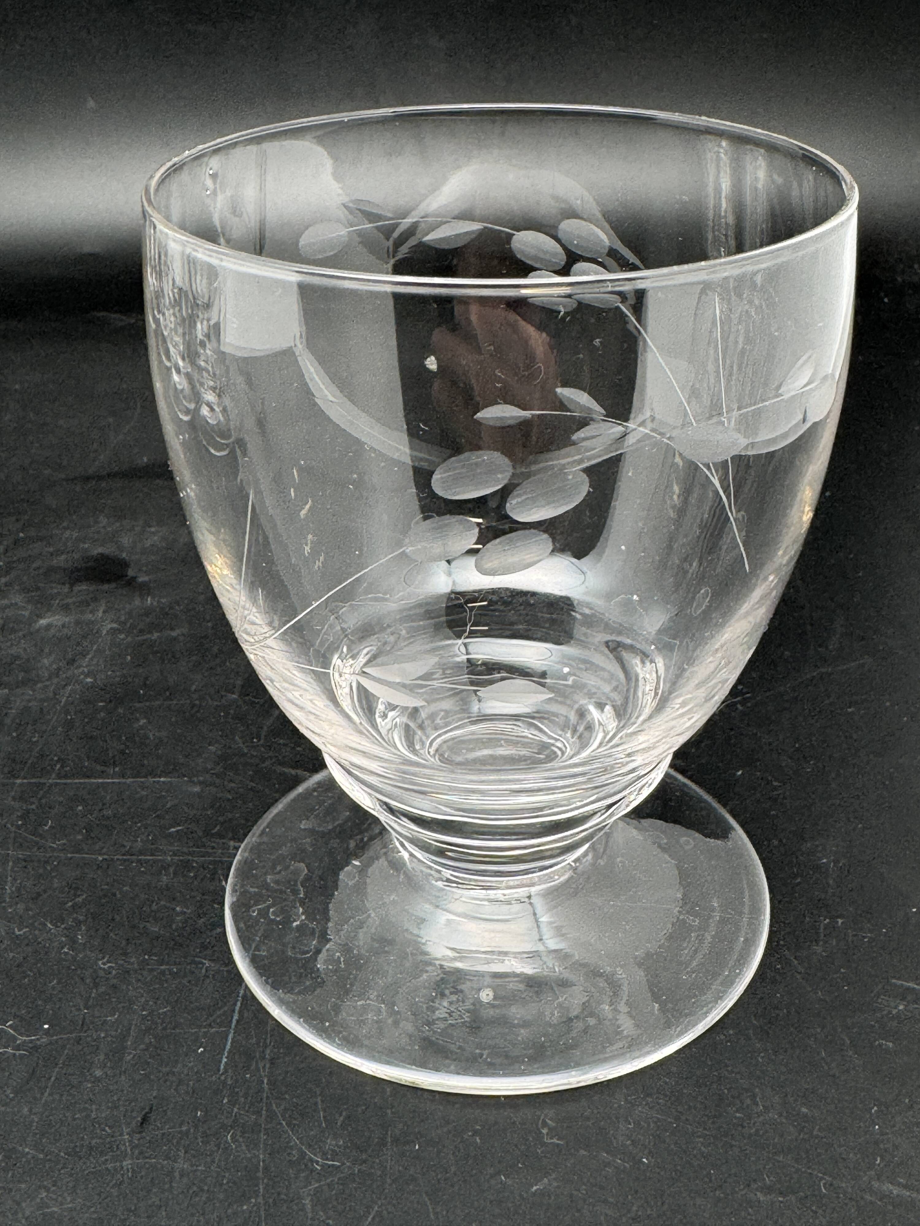 Set of fine glass stemmed glasses with small flower patterns
