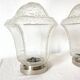 Pair of lantern-style ceiling lights or antique lamps.