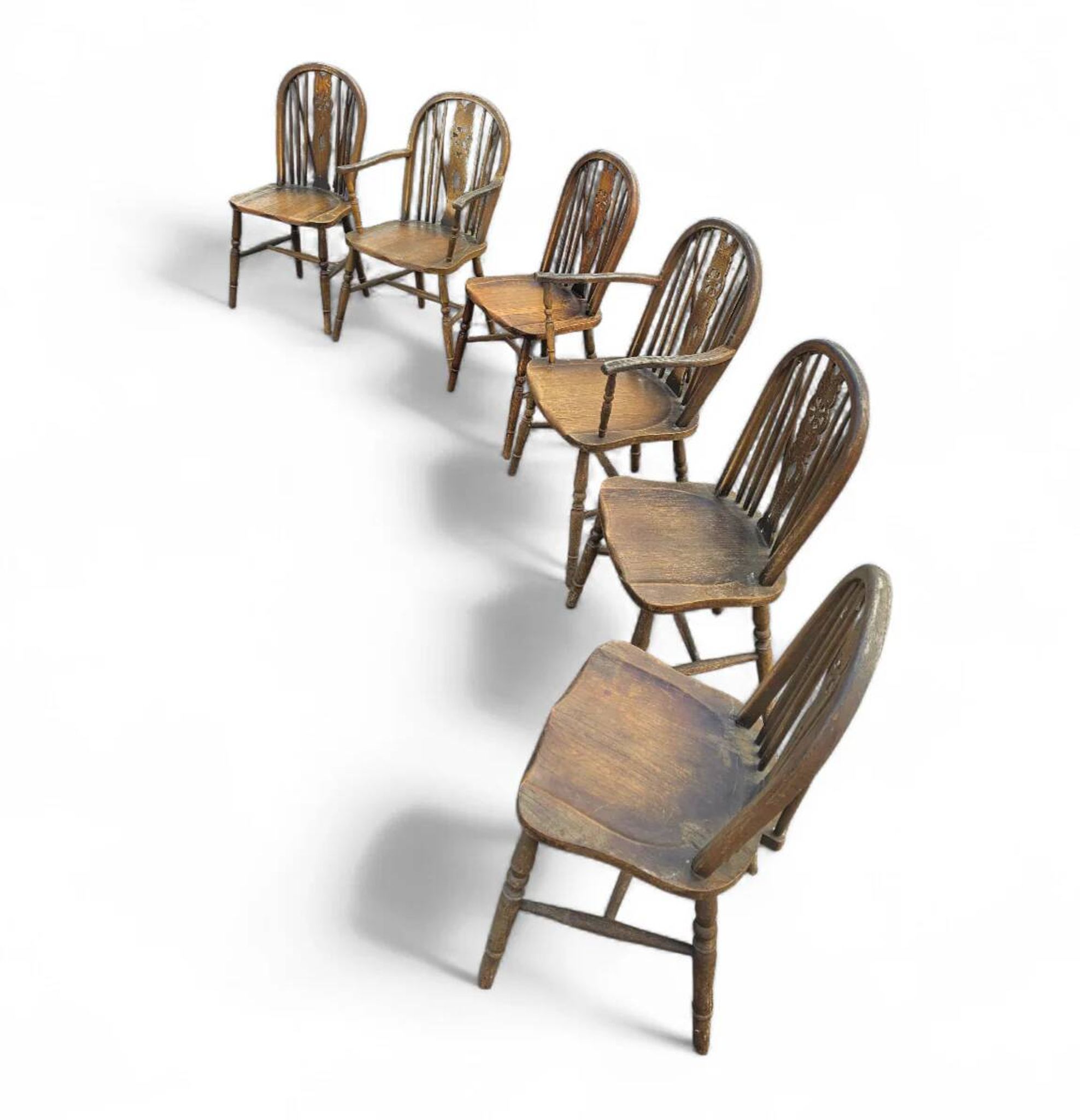 A slightly weathered Windsor wheelback dining set (7) by Oirschotse Meubelindustrie 1950s