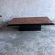 Vintage coffee table in wood burl on a black lacquered base.