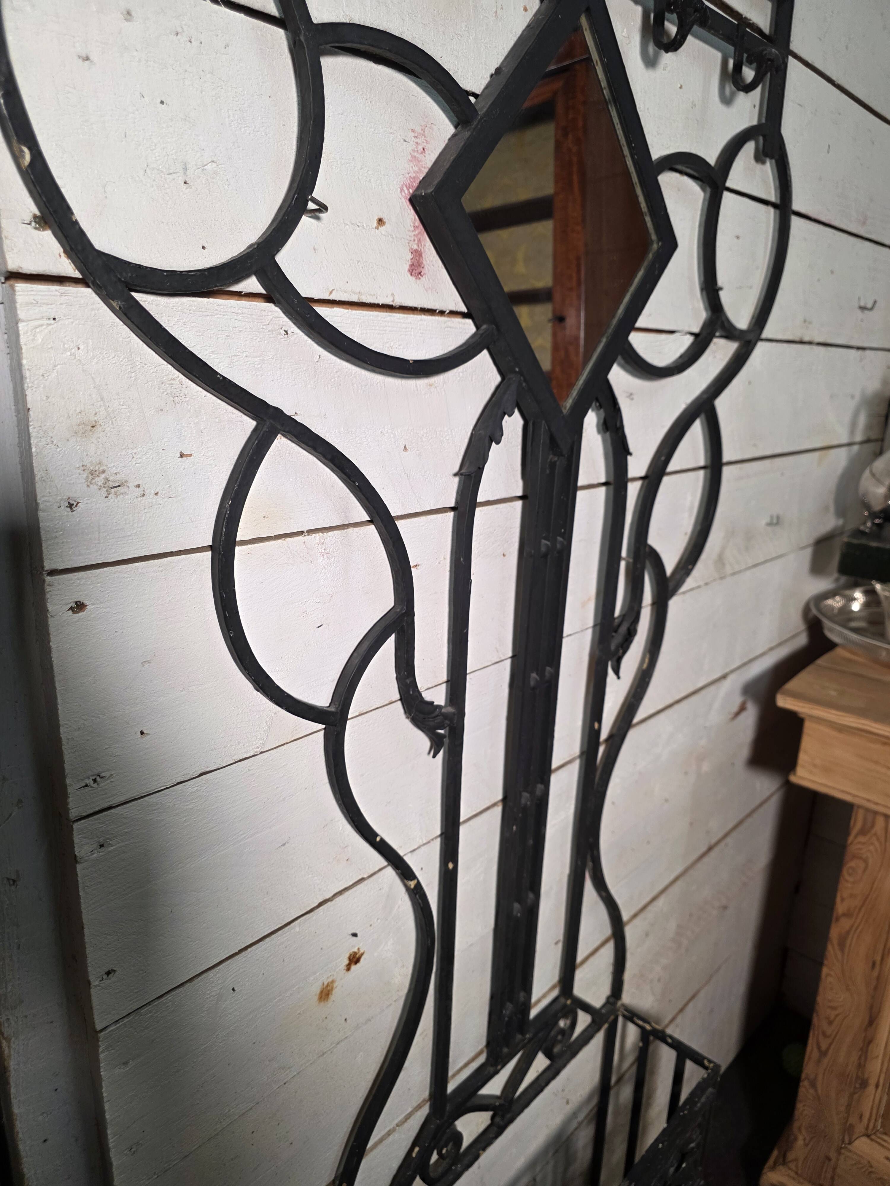 Art Deco coat rack wardrobe in wrought iron from the 1930s.