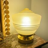 Old globe table lamp in beige and gold glass