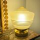 Old globe table lamp in beige and gold glass