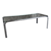 Coffee table with chrome legs and glass top, 1970