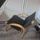 pair set of 2 armchairs with a wooden frame and black fabric weaving