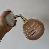 Vintage globe wall light in frosted pink and gold glass.
