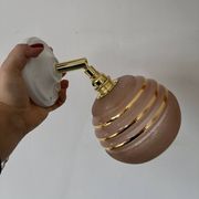 Vintage globe wall light in frosted pink and gold glass.
