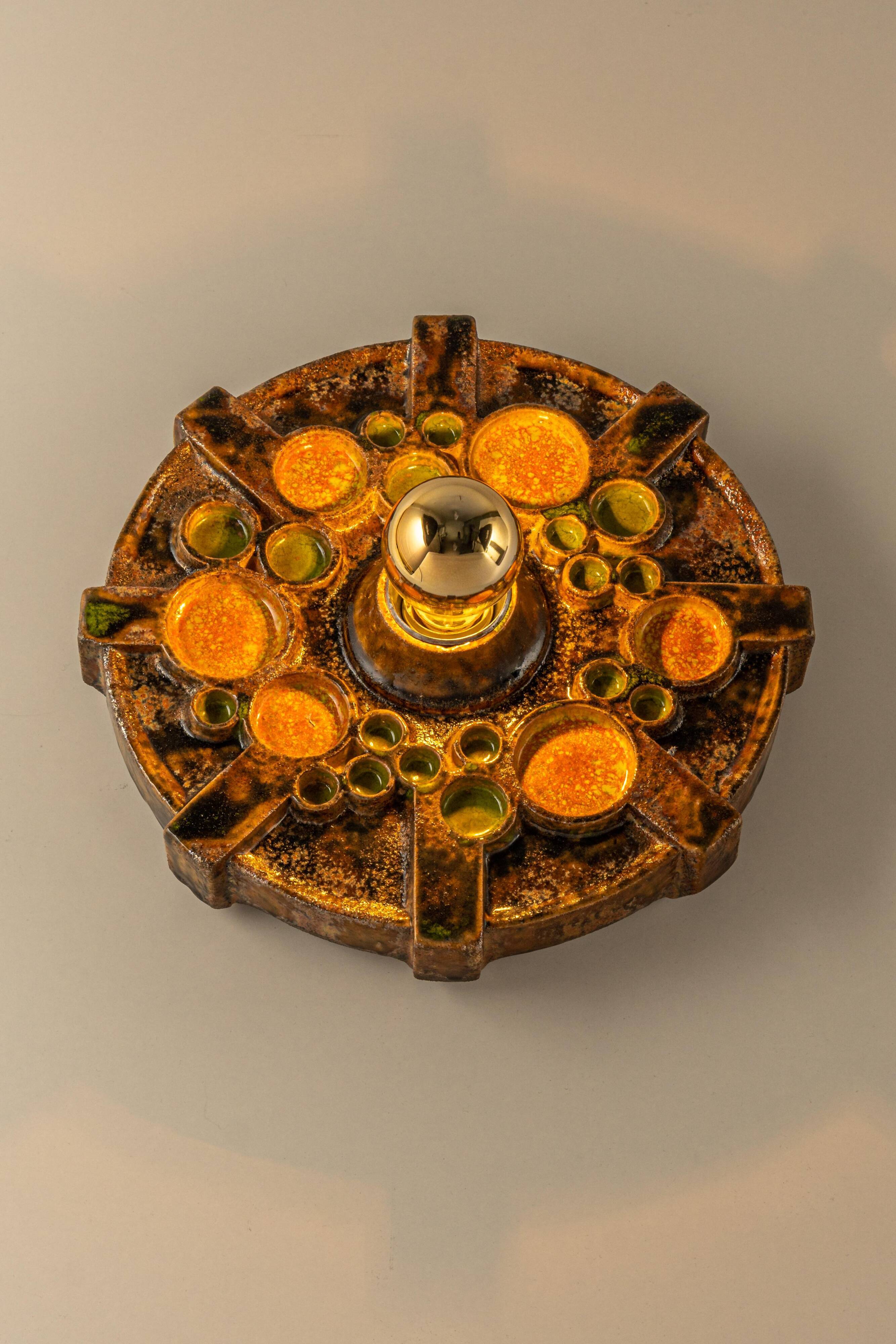 Sputnik wall lamp in brown and orange ceramic, Germany, 1970s.