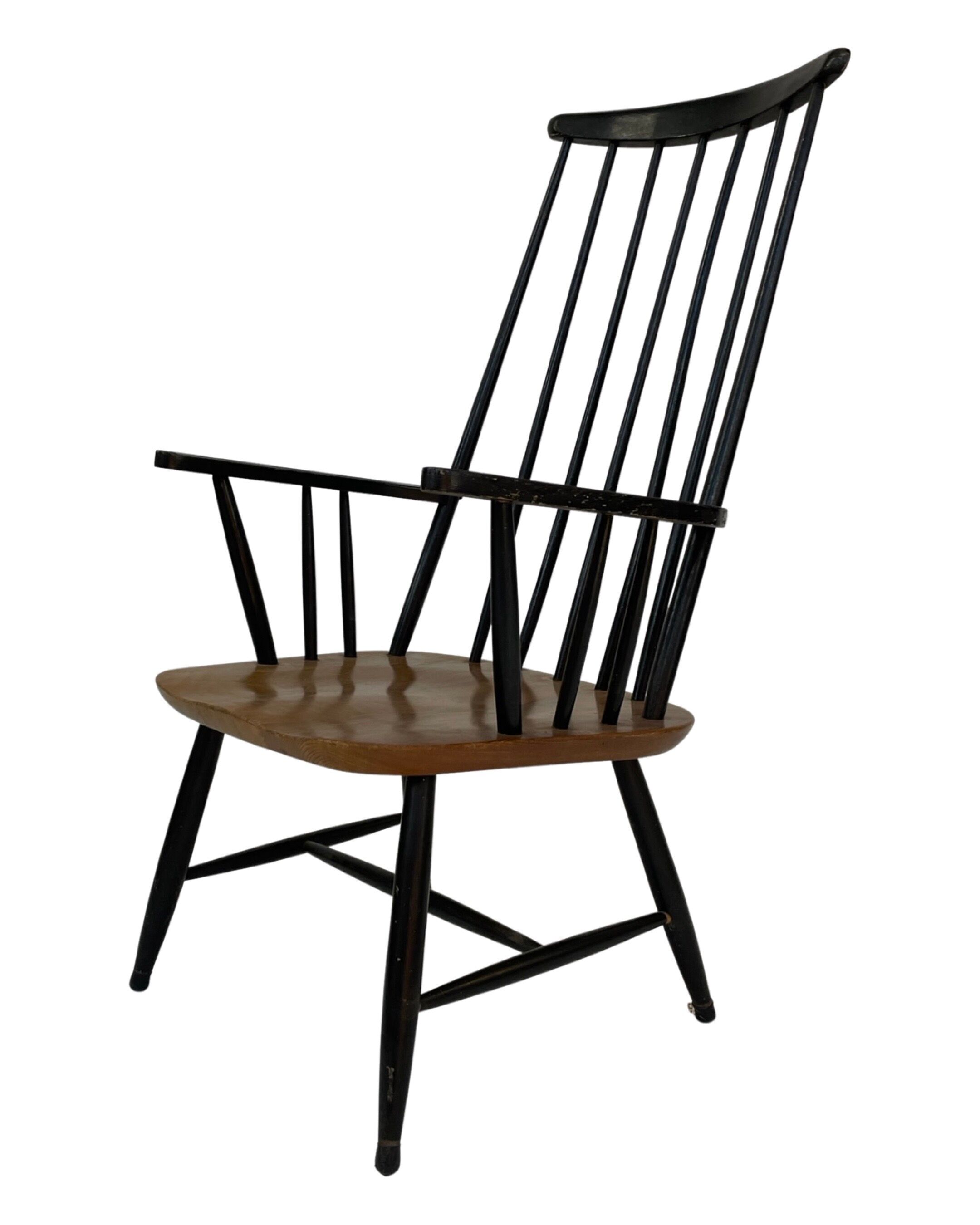 Vintage easy chair with high back and armrest from the 60s