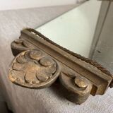 Antique wooden mirror with an unusual shape