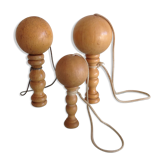 Suite of three old light wood bilboquets