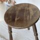 Antique tripod stool in turned wood