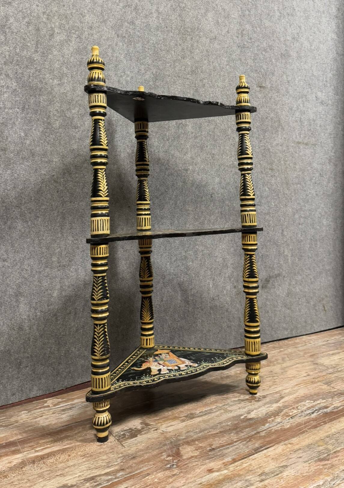 India circa 1900: attractive corner shelf in lacquered and painted wood