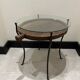 decorative wrought iron round table, glass and wood top.