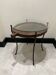 decorative wrought iron round table, glass and wood top.