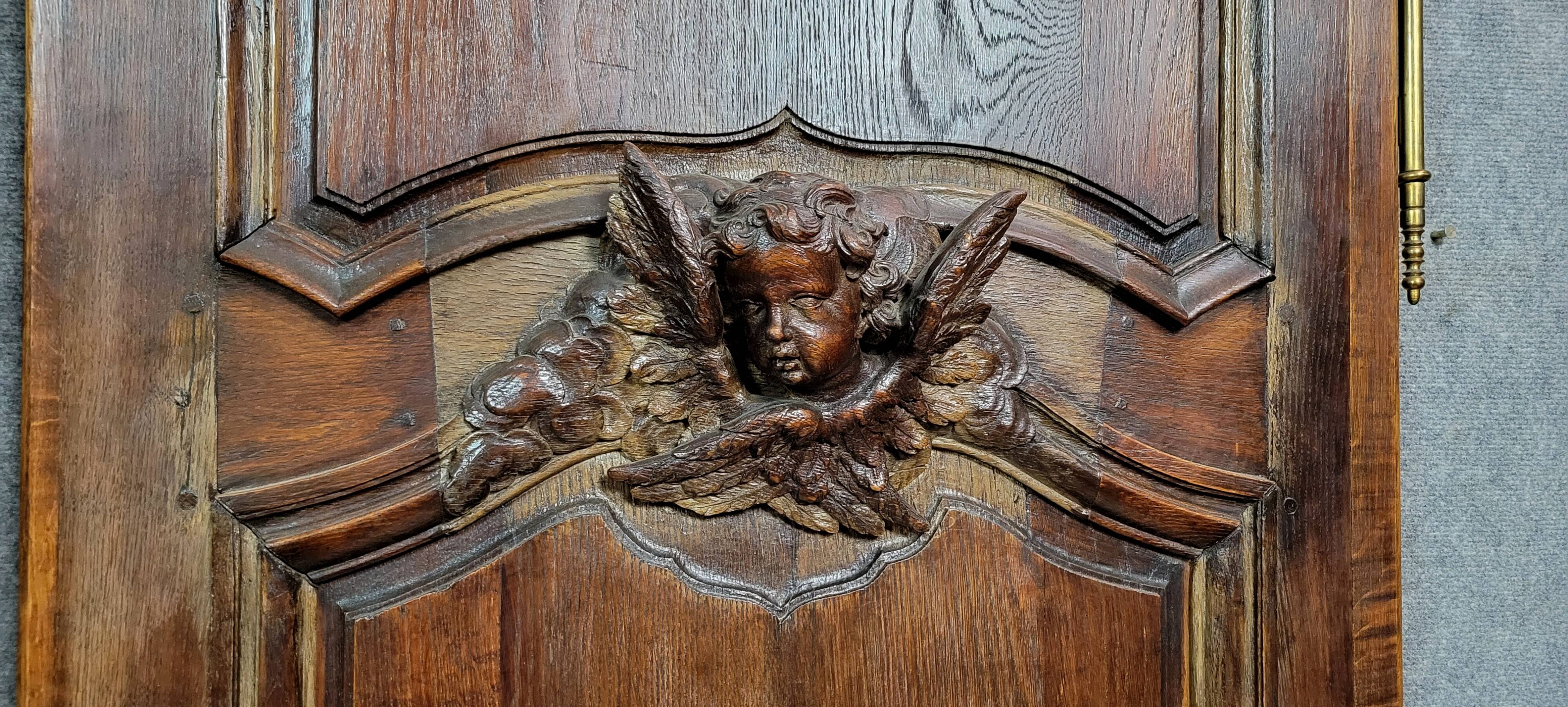 Pair of 18th century oak woodwork castle doors with putti