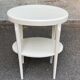 Vintage solid wood stool painted in beige.