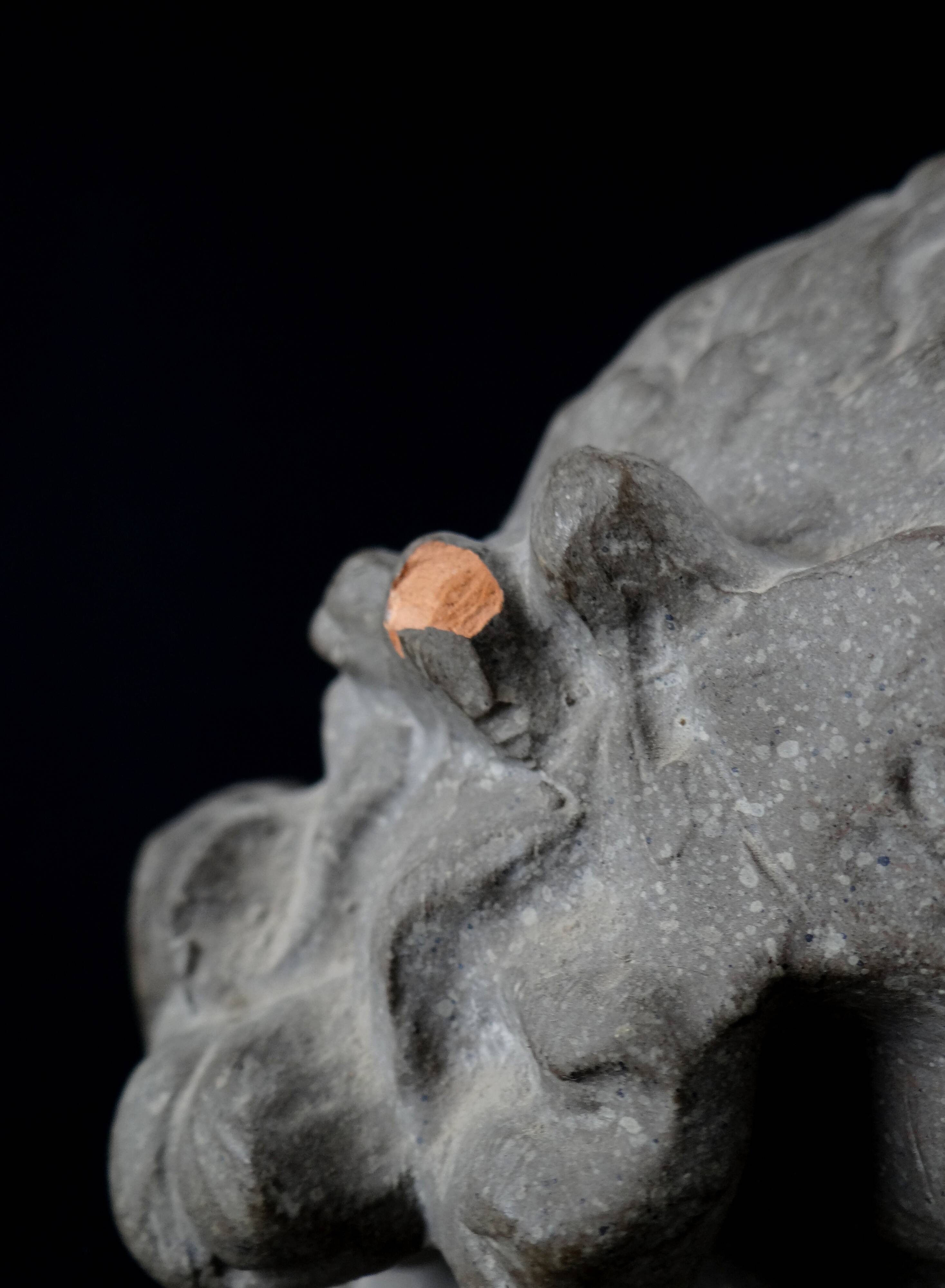 Terracotta bust of the smiling angel from Reims Cathedral with base
