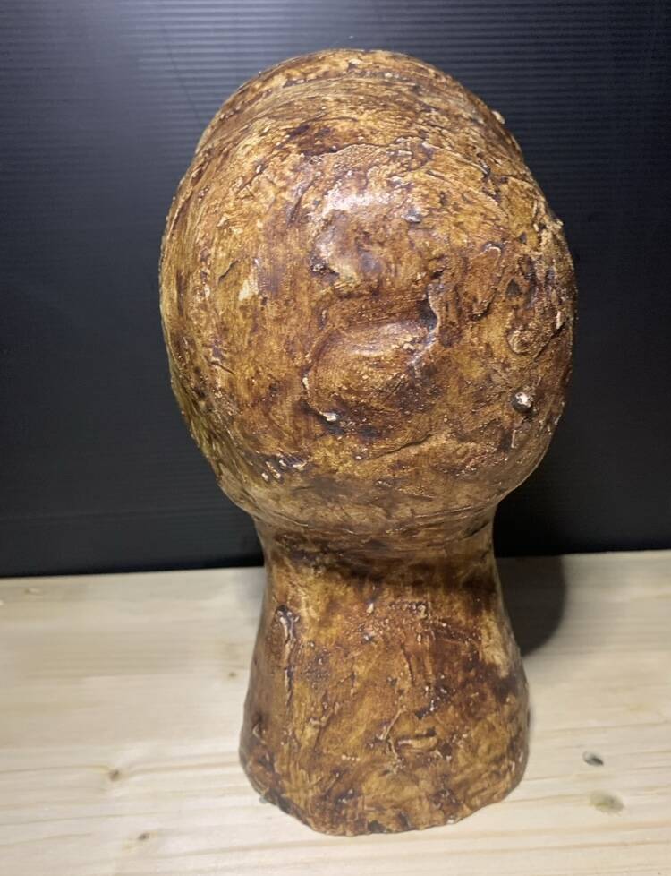 Brutalist head in varnished plaster