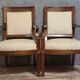 Pair of Empire period armchairs, in mahogany and gilded bronze.