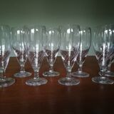 Eight champagne flutes in engraved glass