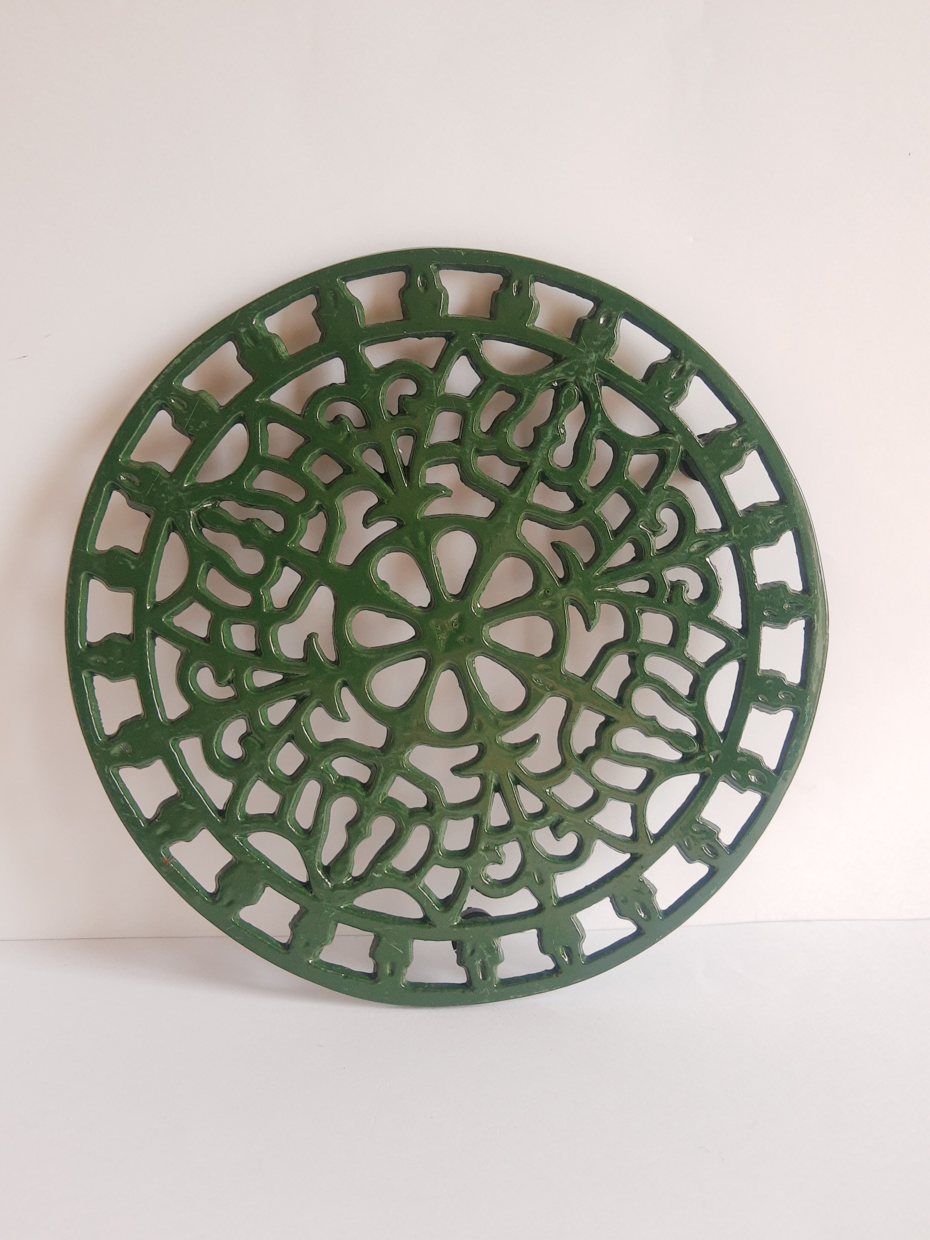 Vintage green cast iron trivet