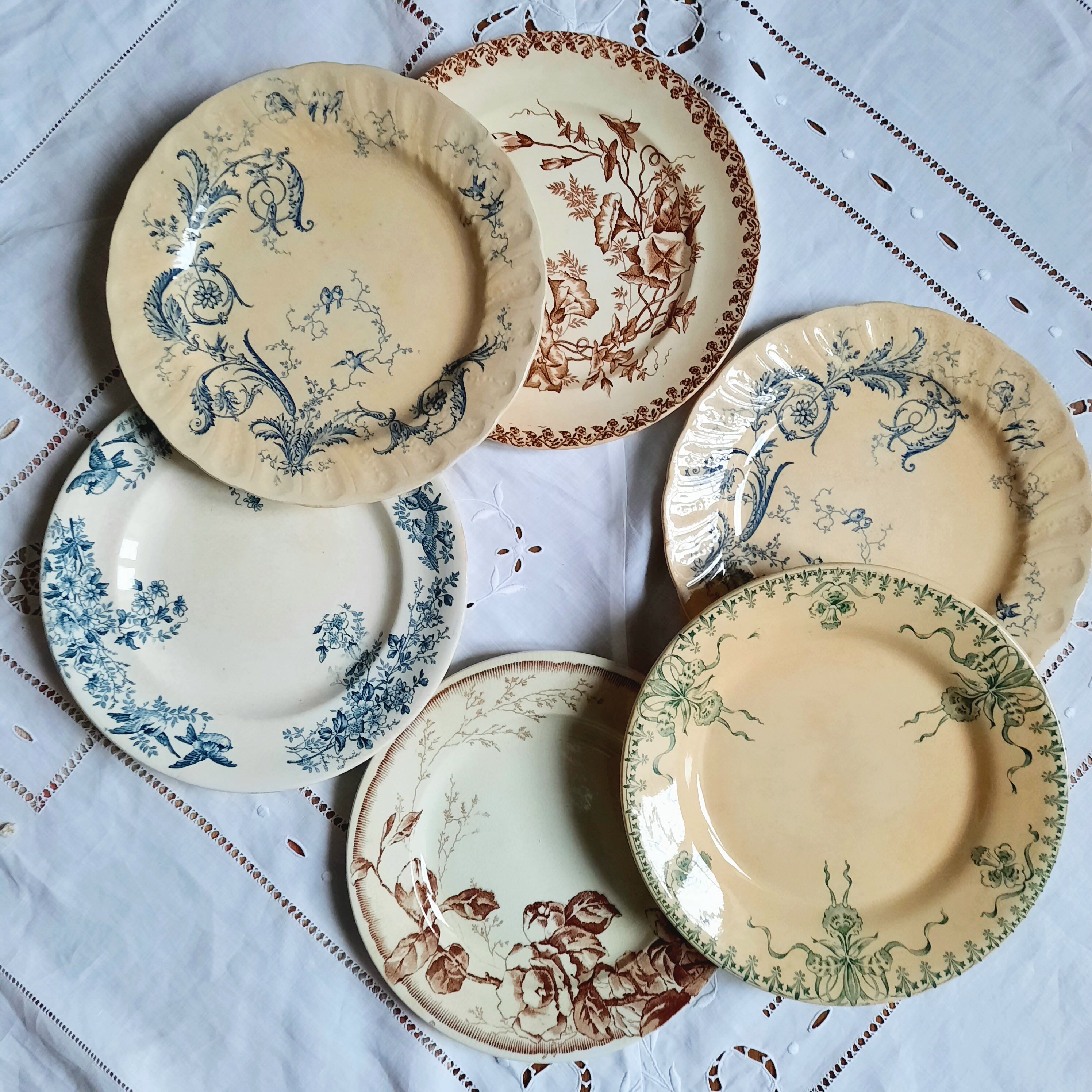 Old flat plates mismatched in earthenware