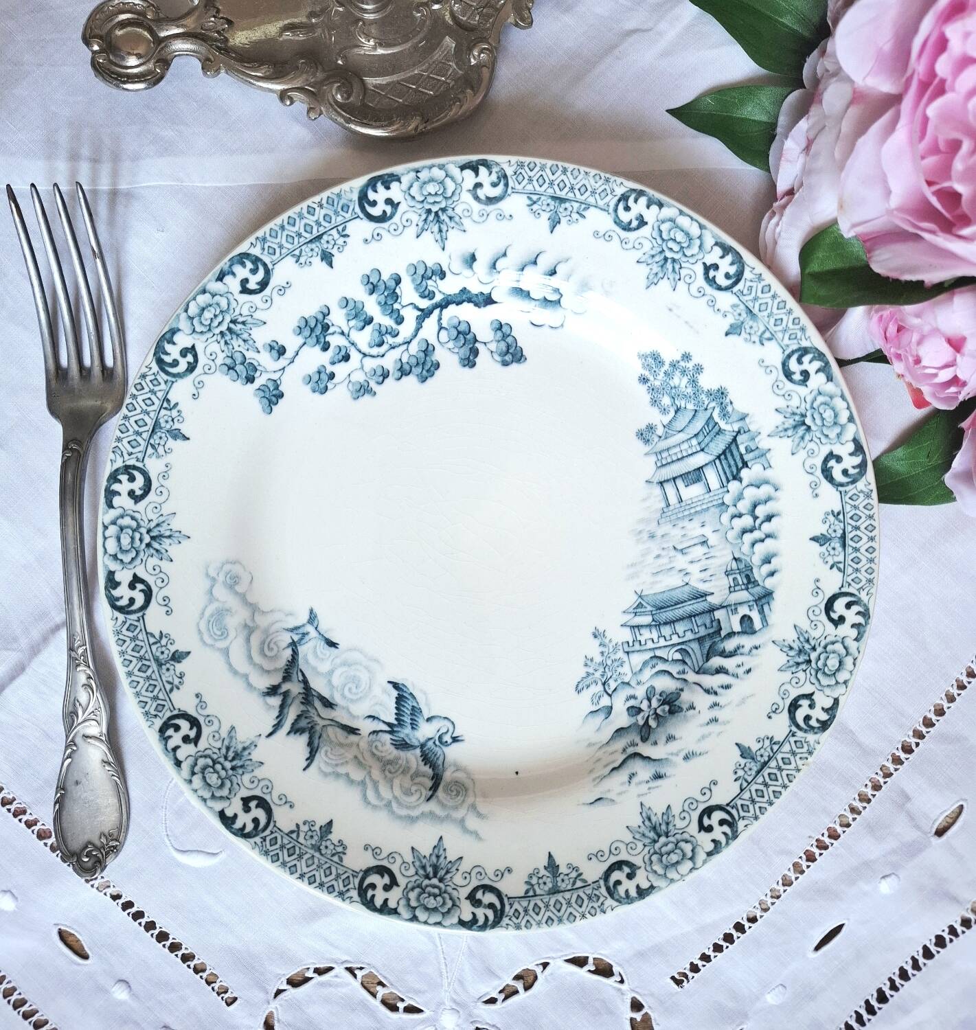 Mismatched antique flat plates made of ironstone accompanied by