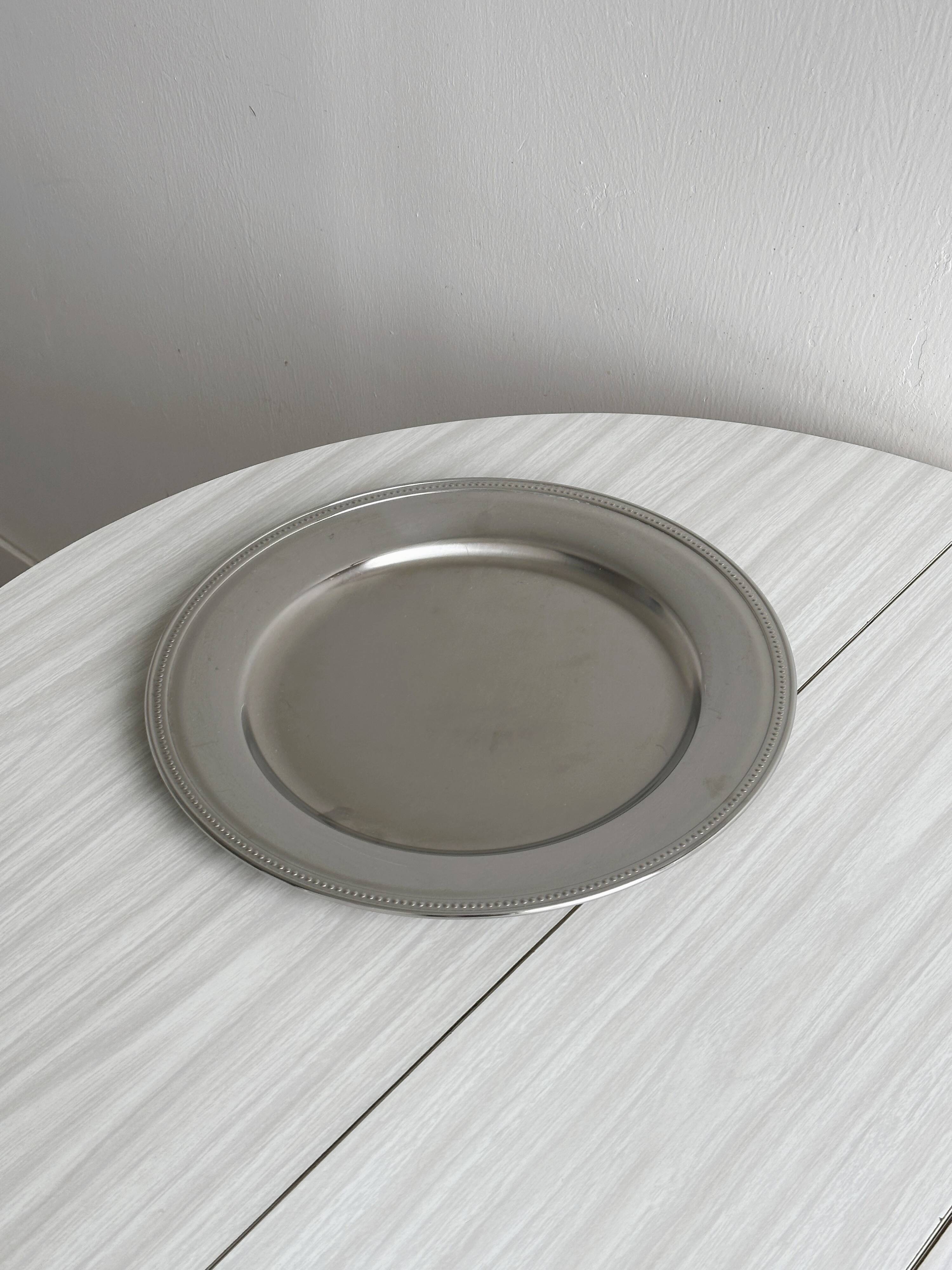 Large shiny stainless steel tray