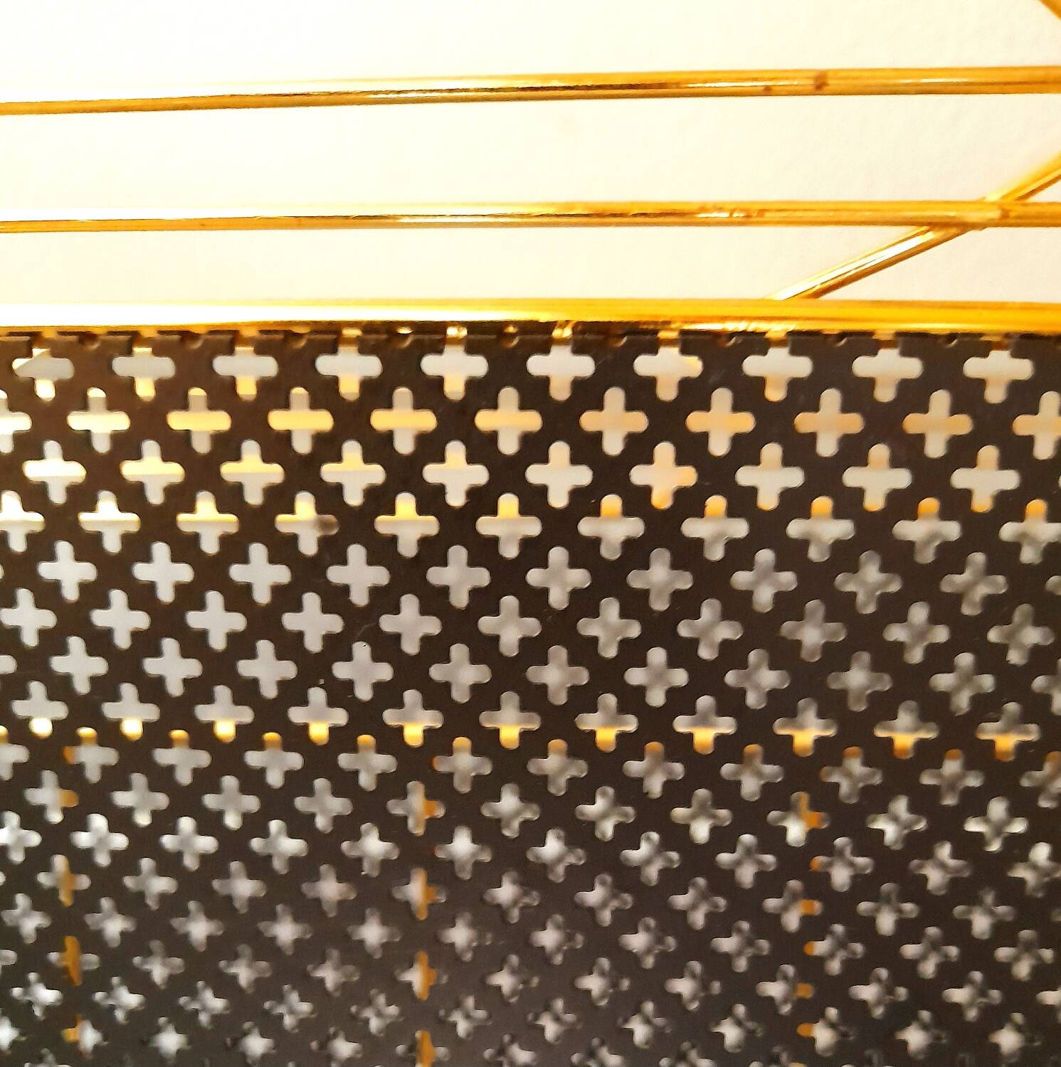 Perforated metal magazine rack 1950