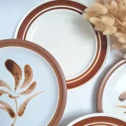 Brown flower-patterned plates from the 1970s.
