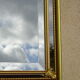 Vertical mirror, gold frame with beading.
