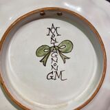 Pair of plates with floral decoration in Nevers earthenware signed Montagnon