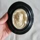 Ancient religious medallion, Jesus Christ in plaster with a blackened wooden frame.
