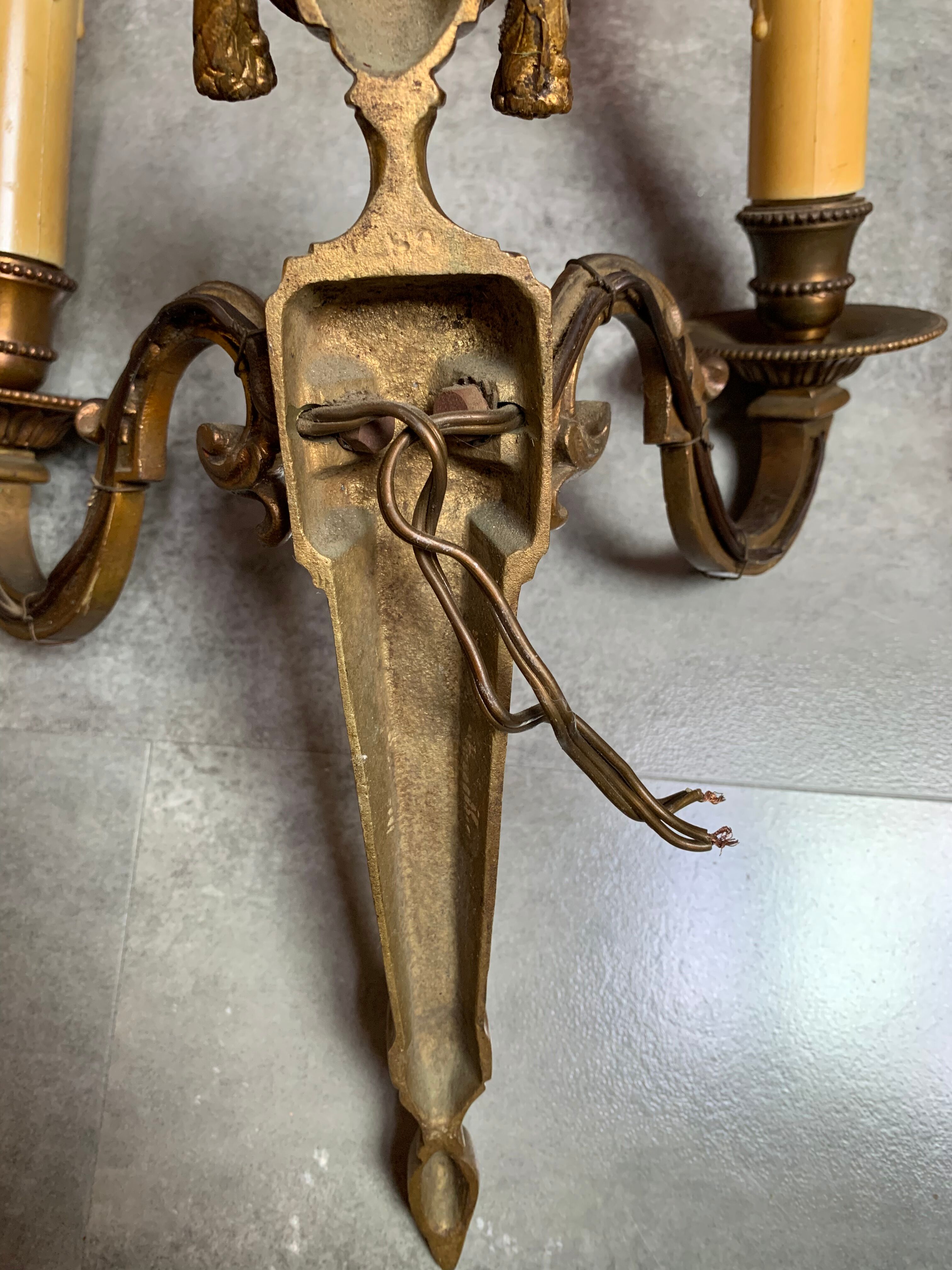 Double brass sconces