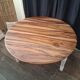 Round walnut table convertible into a console.
