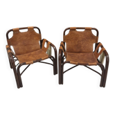 Pair of Tito Agnoli armchairs in leather from the 1970s.