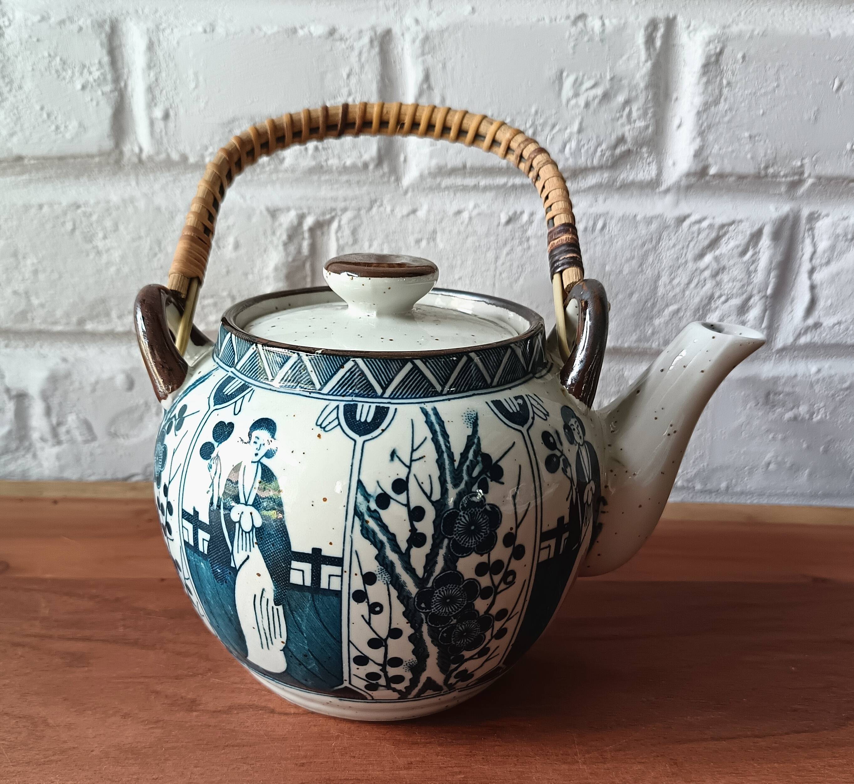 Asian ceramic and rattan tea set with plant geisha motifs