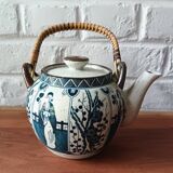 Asian ceramic and rattan tea set with plant geisha motifs