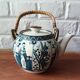 Asian ceramic and rattan tea set with plant geisha motifs