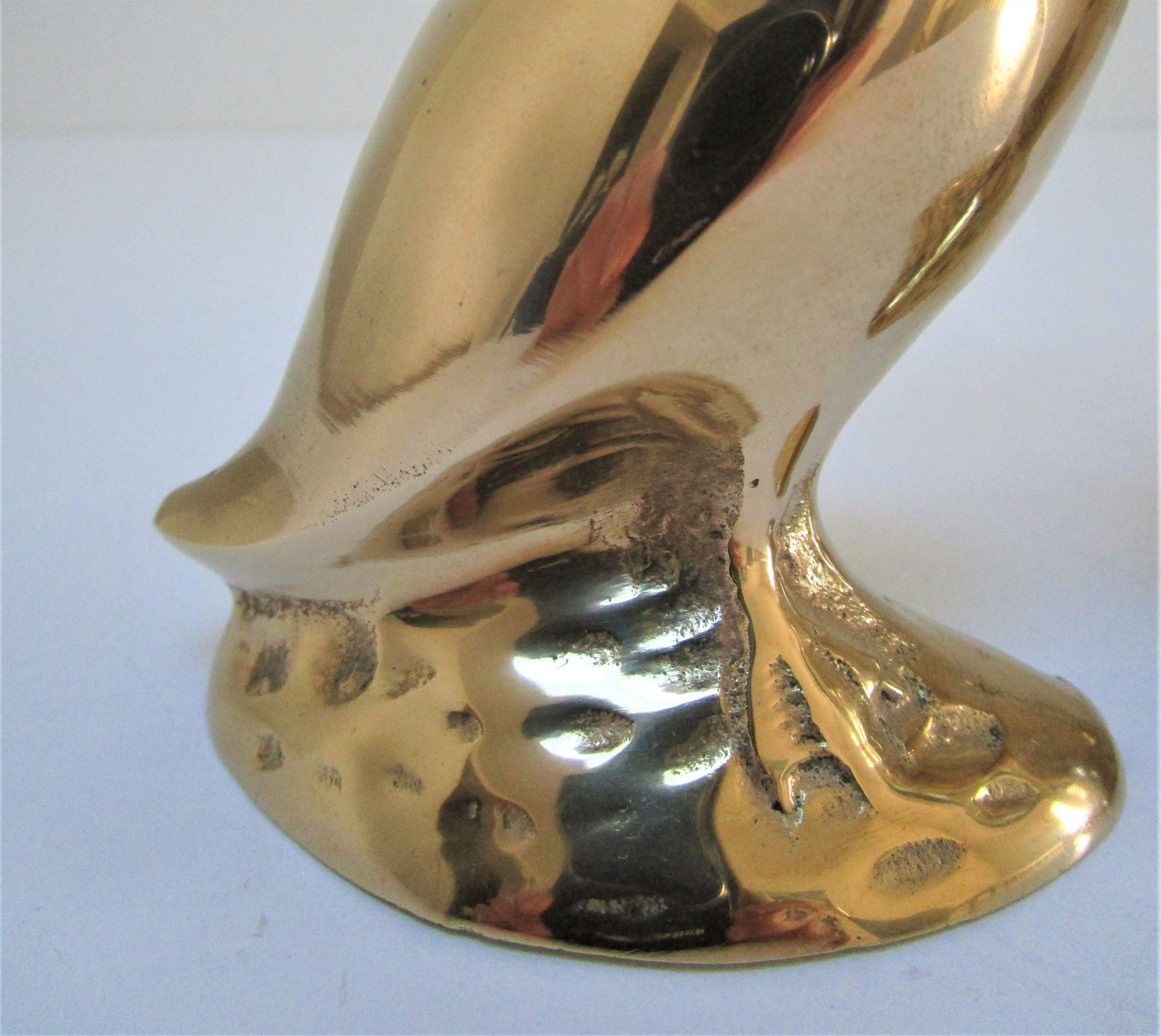 Pair of stylized birds in solid brass