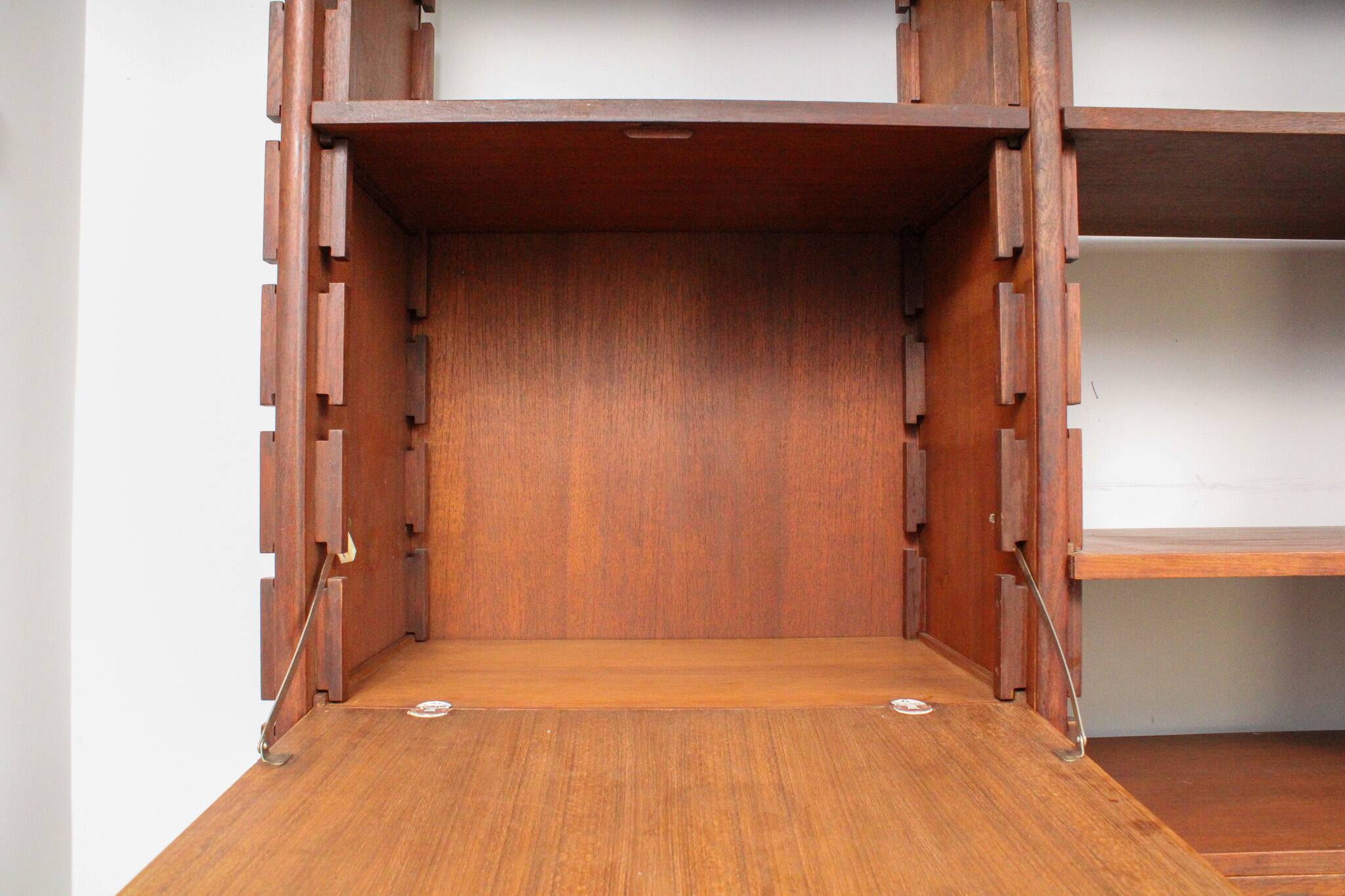 A vintage mid-century teak Gianfranco Frattini style bookcase room divider