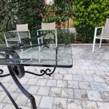 Large rectangular table in cast iron and glass top