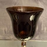 Tinted glass photophore on high metal foot with silver patina